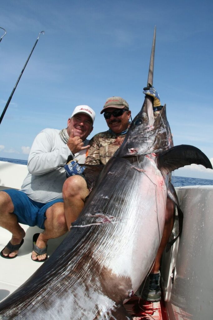 Angler and captain Dean Panos with another monster swordfish.