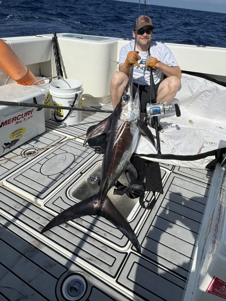 Angler showing off his swordfish