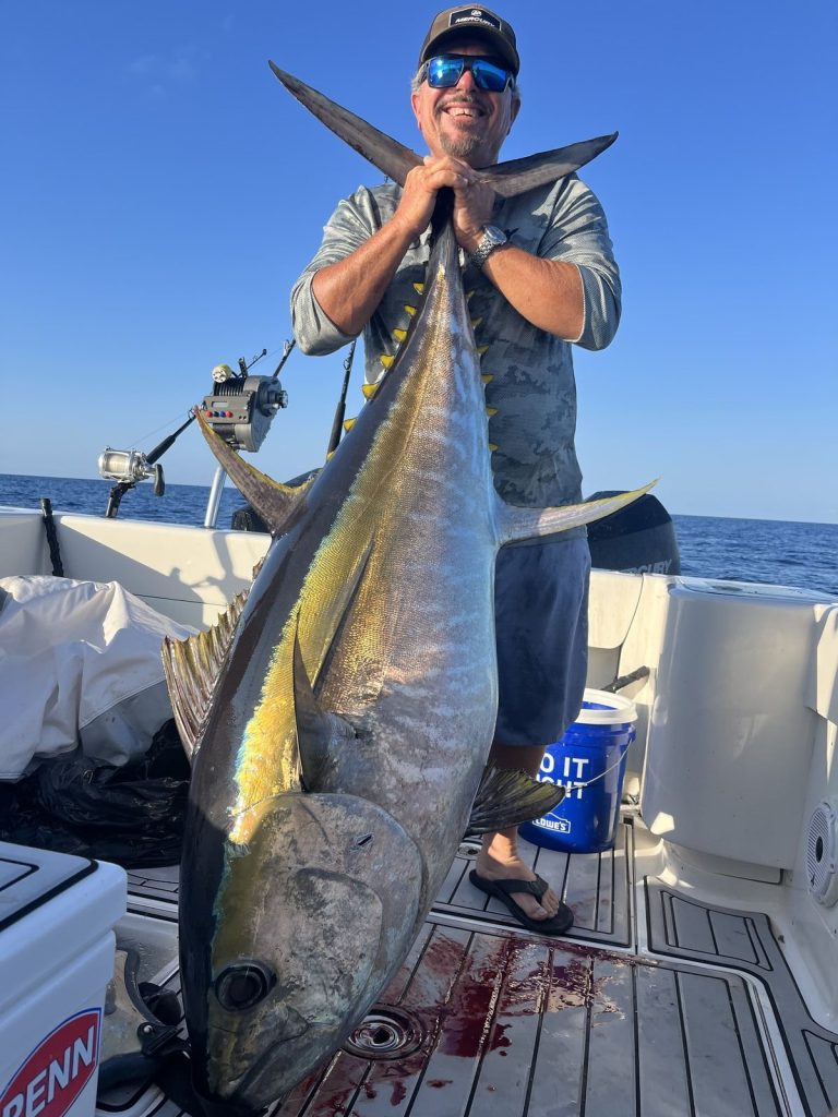 Captain Dean Panos with a 176 lb. big eye tuna caught in the Bahamas