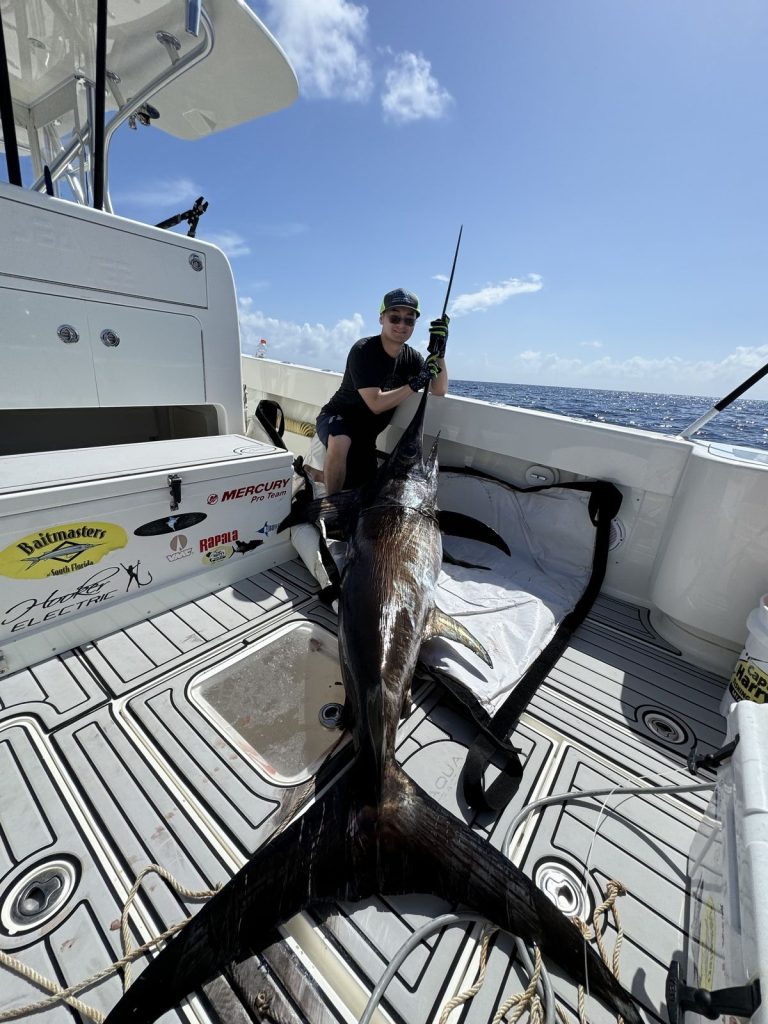 Angler with a nice swordfish on the deck